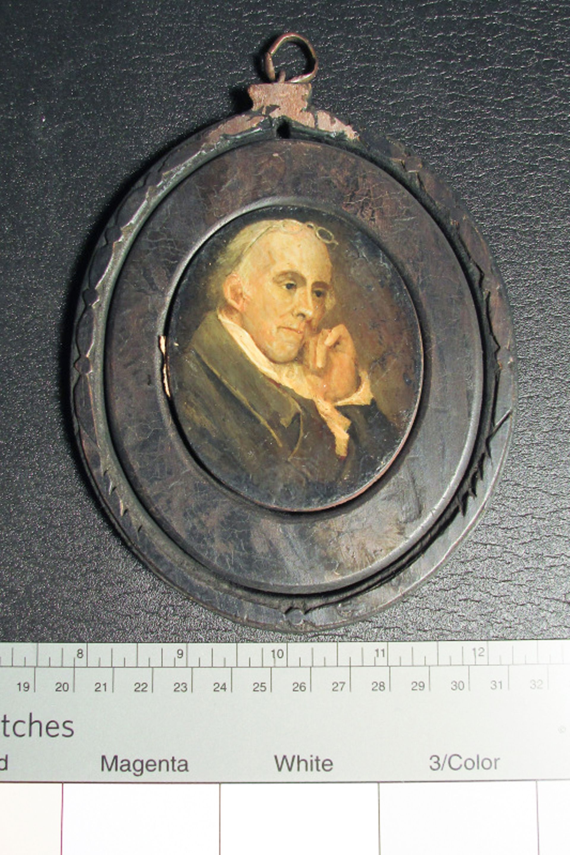 Dark, wooden oval frame holding a colored painting of Benjamin Rush